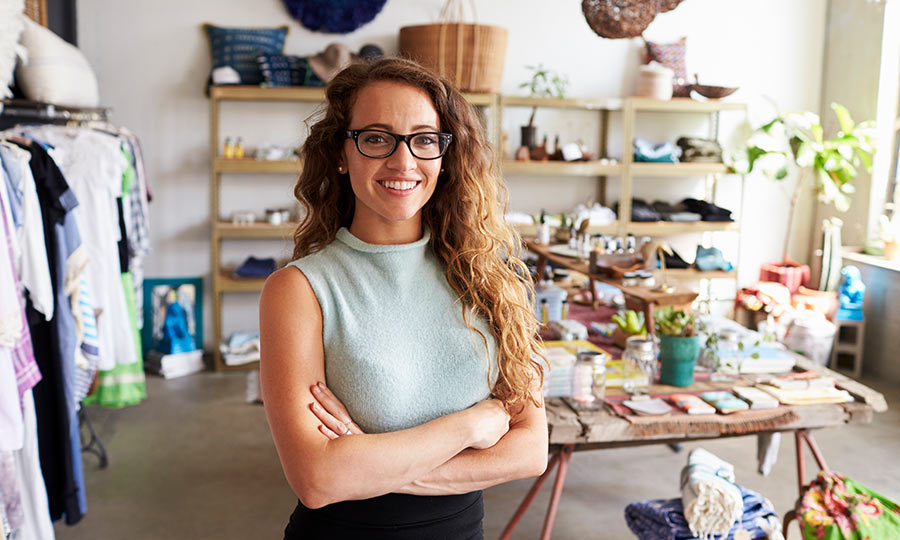 female-business-owner-inside-her-clothing-shop